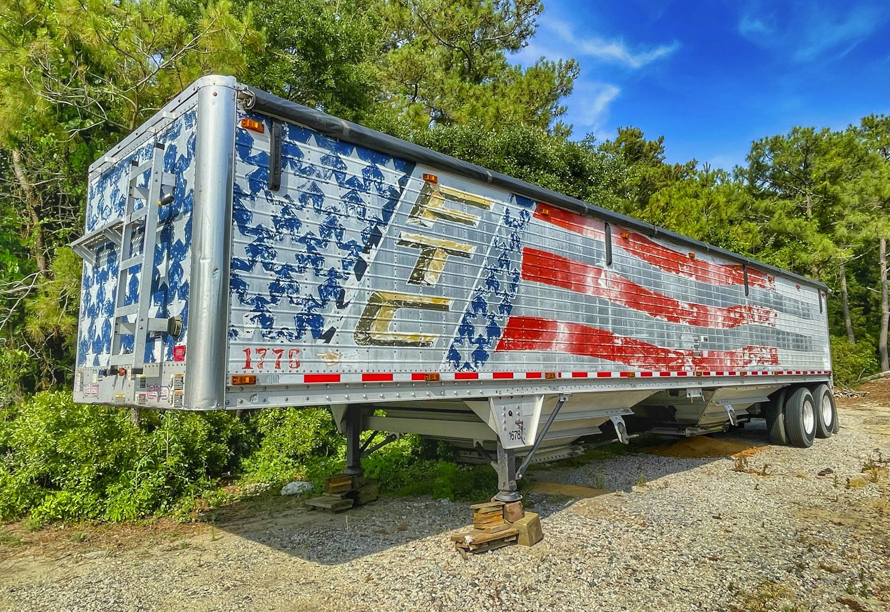 Semi trailer painted with an American flag